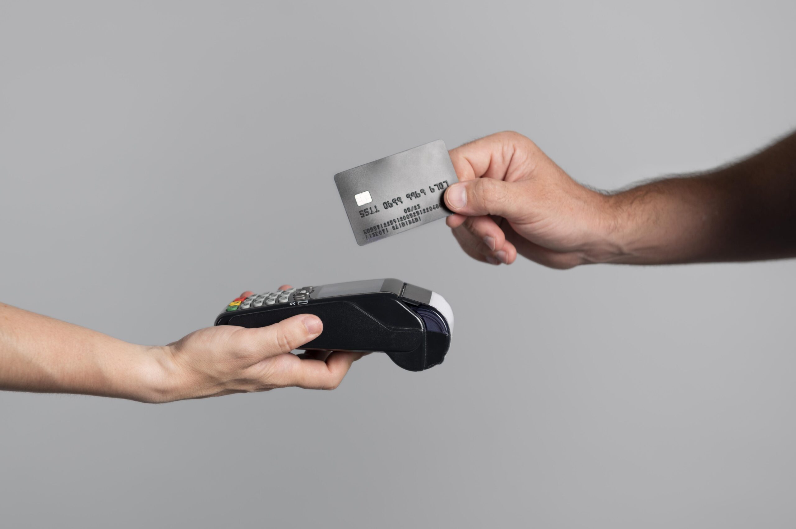 man-using-his-credit-card-pay-product
